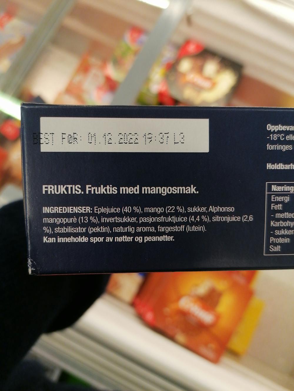 Ingredienslisten til Nude mango, 80% frukt på pinne, Hennig Olsen