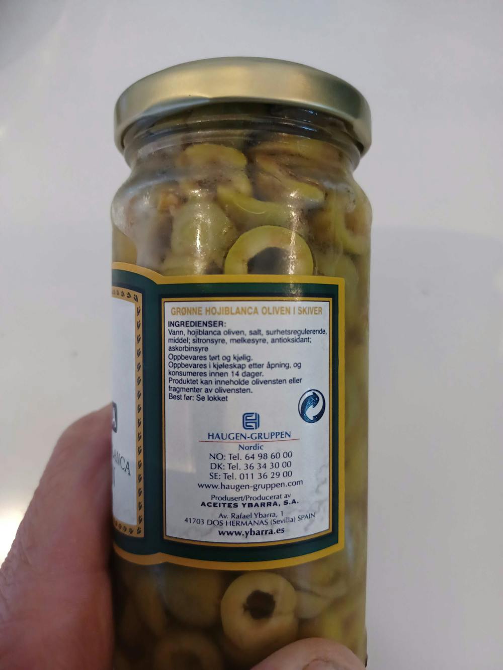 Ingredienslisten til Grønne hojablanca oliven, i skiver, Ybarra